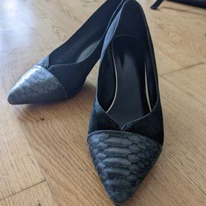 Black heels with snake print pattern